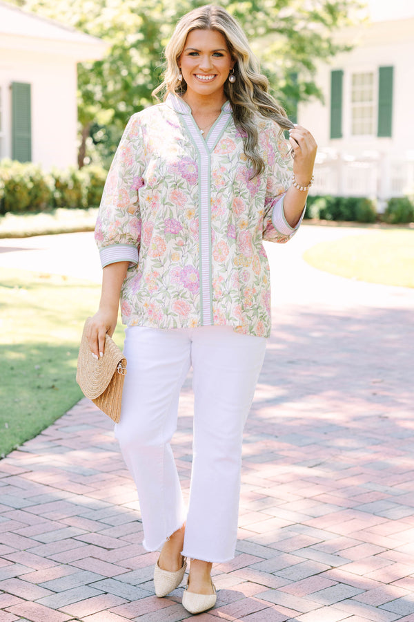 Plus size green floral V-neck top with striped trim and flowy 3/4 sleeves