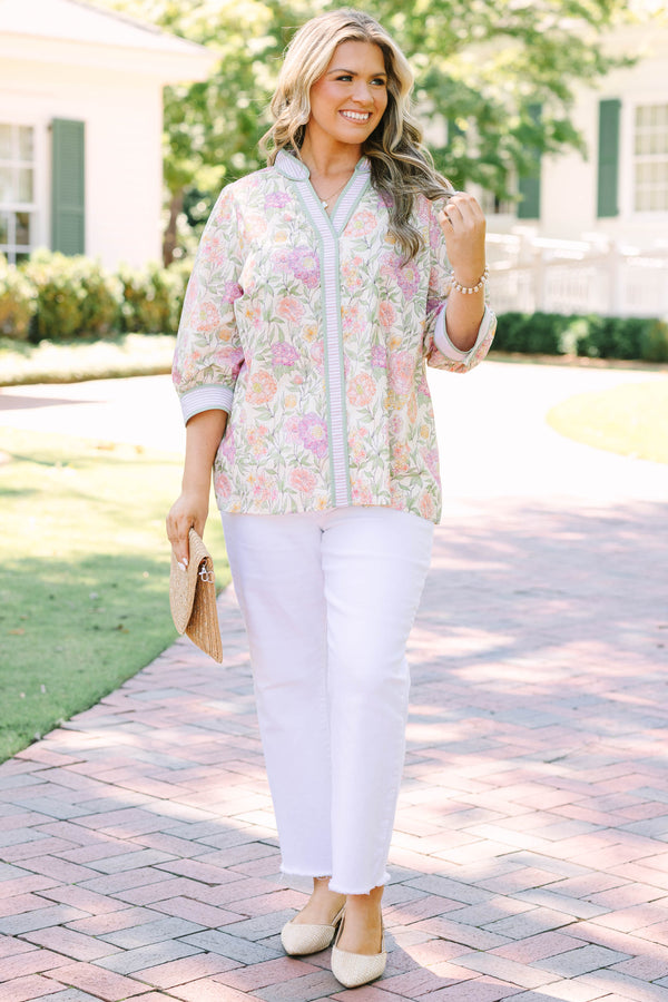 Plus size green floral V-neck top with striped trim and flowy 3/4 sleeves