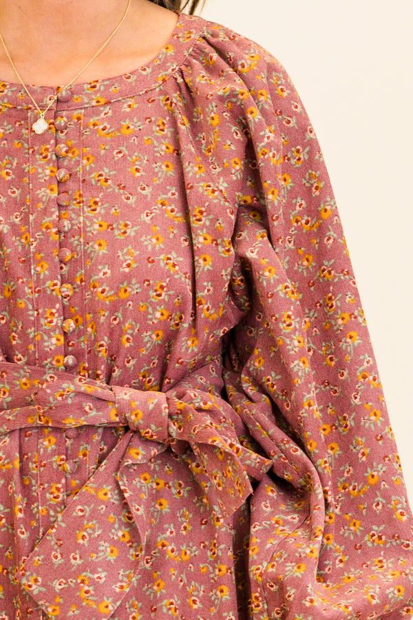 Chic Soul plus size clothing, long-balloon-sleeve mauve ruffled baby doll dress with waist tie and scoop-neckline with small button detailing along the middle and small yellow floral patter