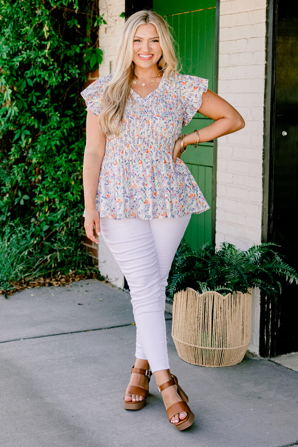 Chic Soul Plus size clothing, Ivory baby doll top with a floral pattern, slight v-neckline and flutter sleeves 
