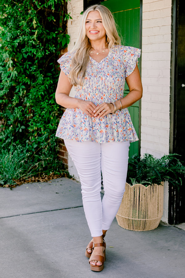 Chic Soul Plus size clothing, Ivory baby doll top with a floral pattern, slight v-neckline and flutter sleeves 
