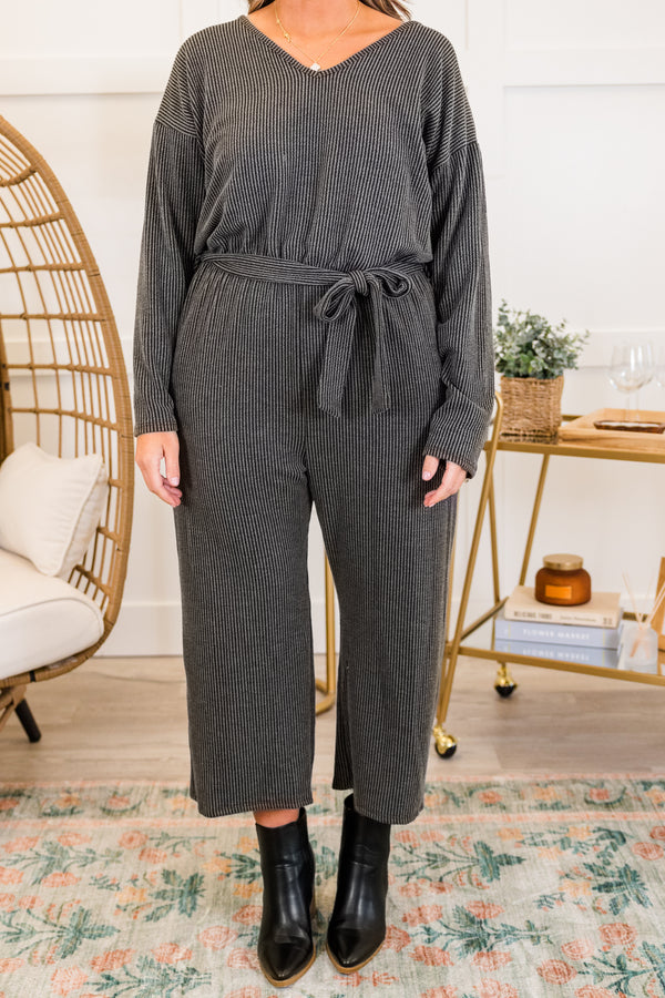Chic Soul plus size clothing, charcoal long sleeve ribbed knit jumpsuit with cinched waist with tie detail and v neckline with cropped length pants with slight flare