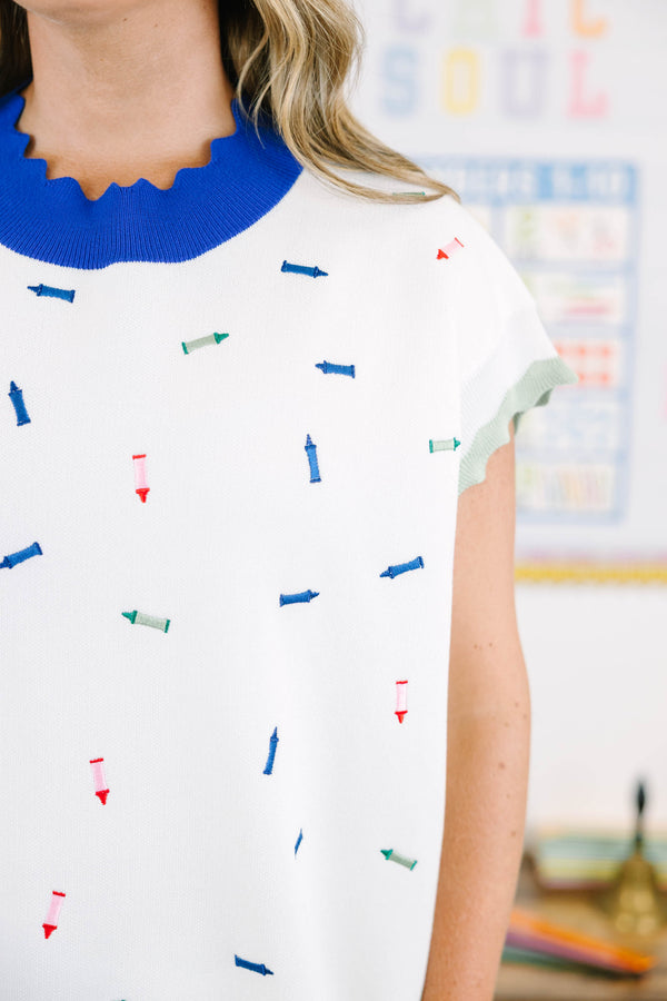 Plus size white short sleeve sweater with colorful crayon embroidery and blue scalloped trim.