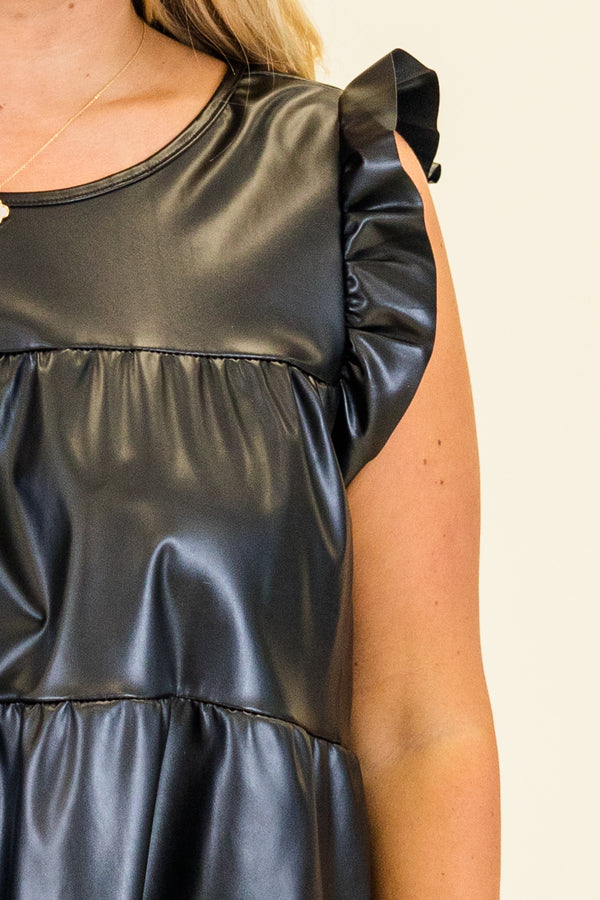 Plus Size black faux leather tiered babydoll top with ruffle shoulder details and a round neckline.