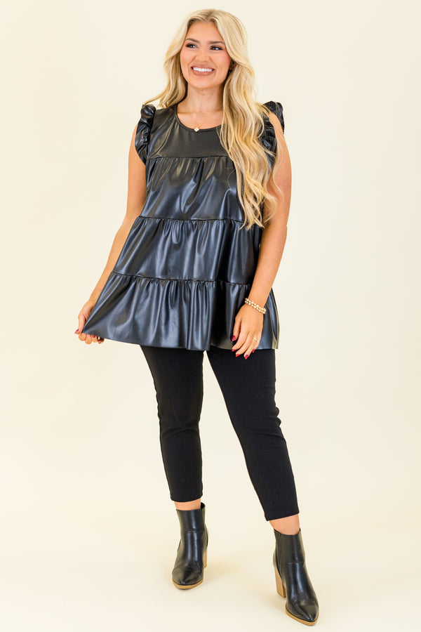 Plus Size black faux leather tiered babydoll top with ruffle shoulder details and a round neckline.