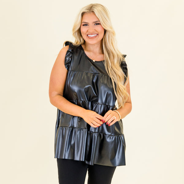 Plus Size black faux leather tiered babydoll top with ruffle shoulder details and a round neckline.