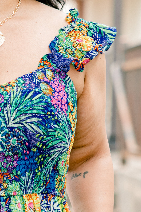 Chic Soul plus size clothing, navy sleeveless jumpsuit with tropical/floral print with square neckline and ruffle straps