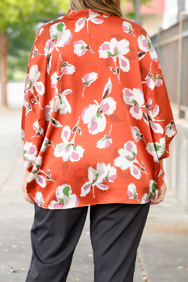 Chic Soul plus size clothing, orange floral pattern flowy top with a v neck and flowy sleeves