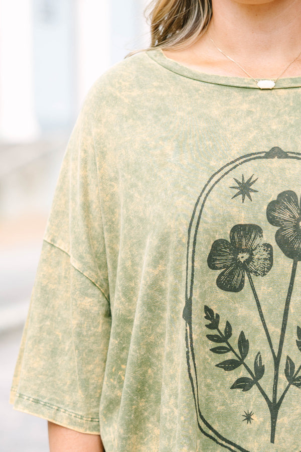Plus Size golden olive acid wash oversized tee with a vintage floral graphic and crew neckline.