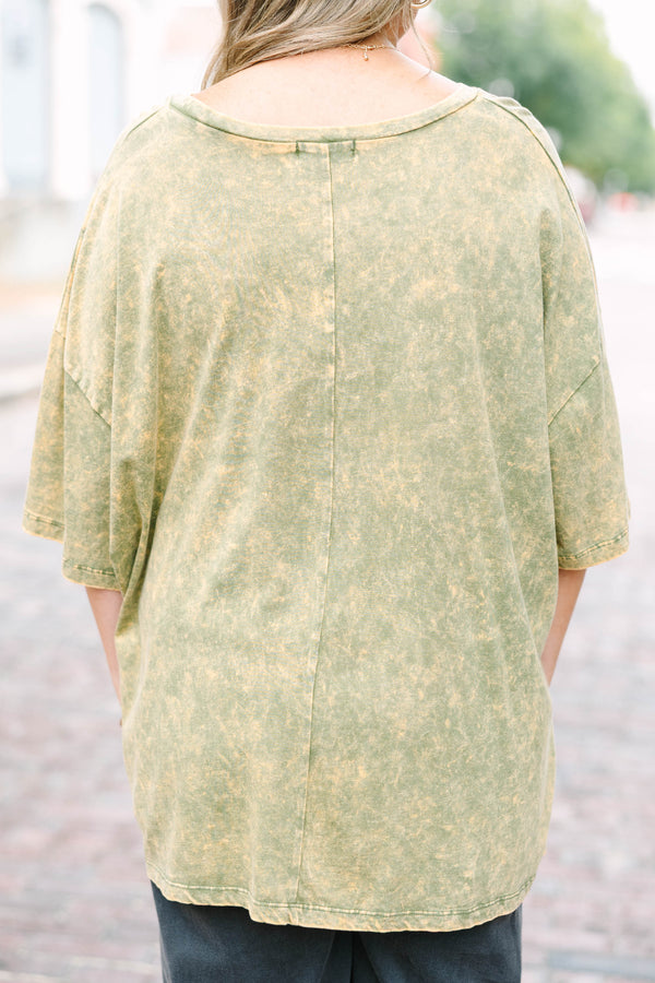 Plus Size golden olive acid wash oversized tee with a vintage floral graphic and crew neckline.