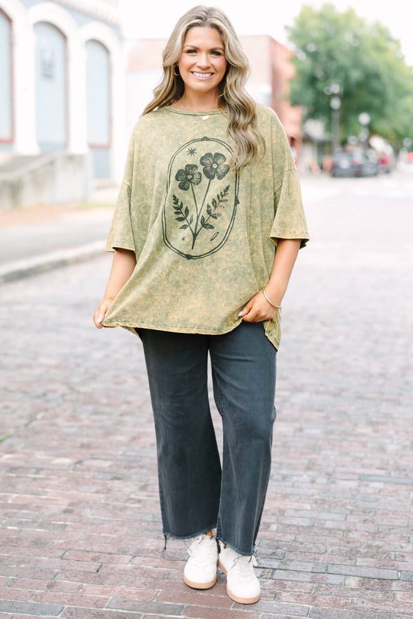 Plus Size golden olive acid wash oversized tee with a vintage floral graphic and crew neckline.