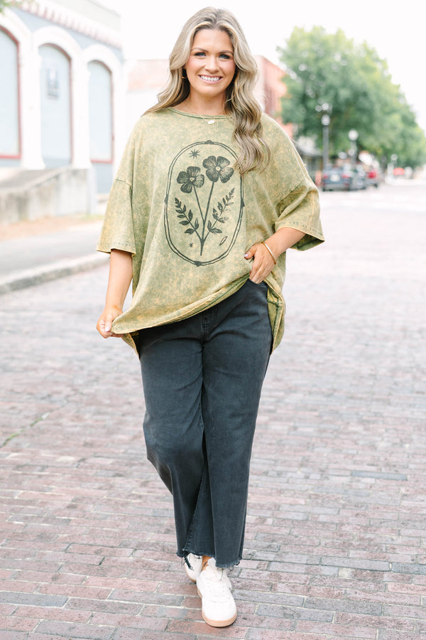 Plus Size golden olive acid wash oversized tee with a vintage floral graphic and crew neckline.