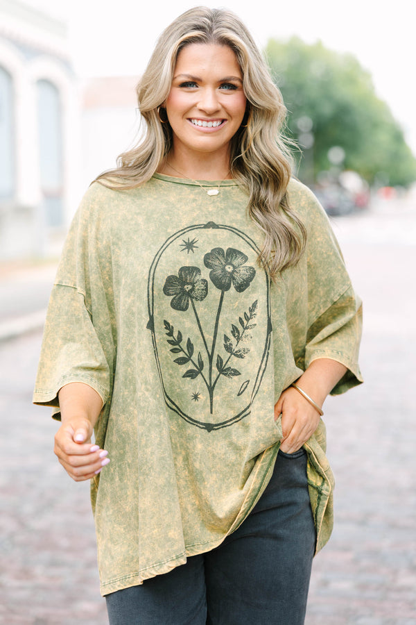 Plus Size golden olive acid wash oversized tee with a vintage floral graphic and crew neckline.