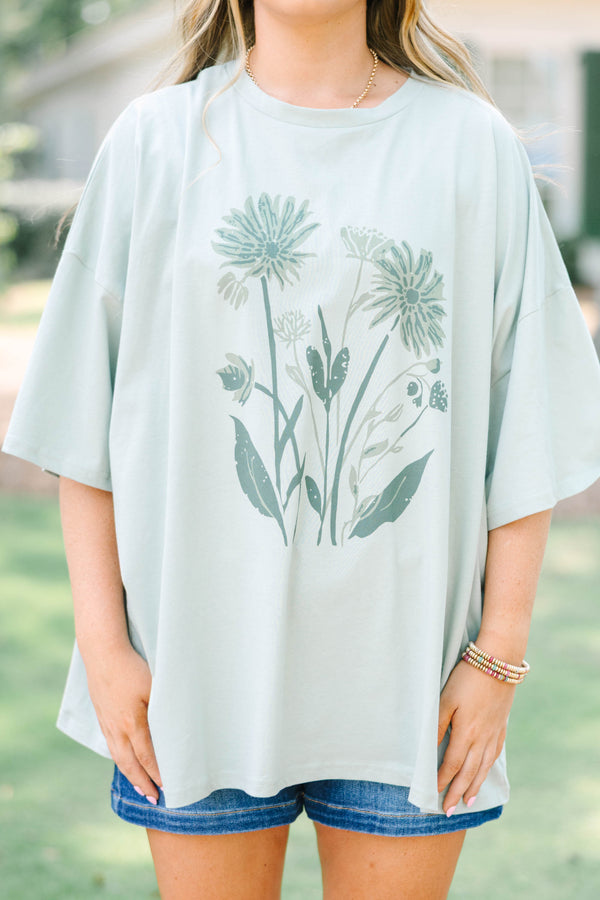 Plus Size light sage boyfriend tee with a dark green floral garden graphic 