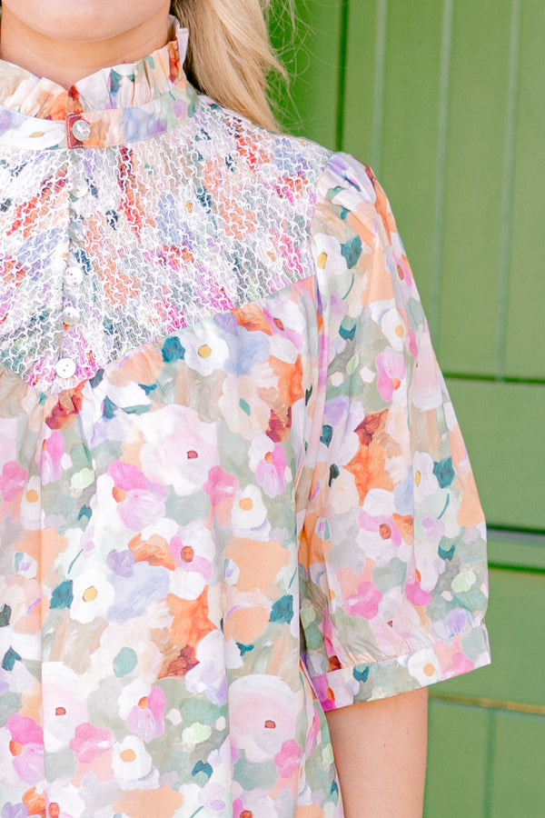 Chic Soul plus size clothing, pink multi colored short sleeve dress with an abstract floral pattern a high neck and a ruffle detailed collar 