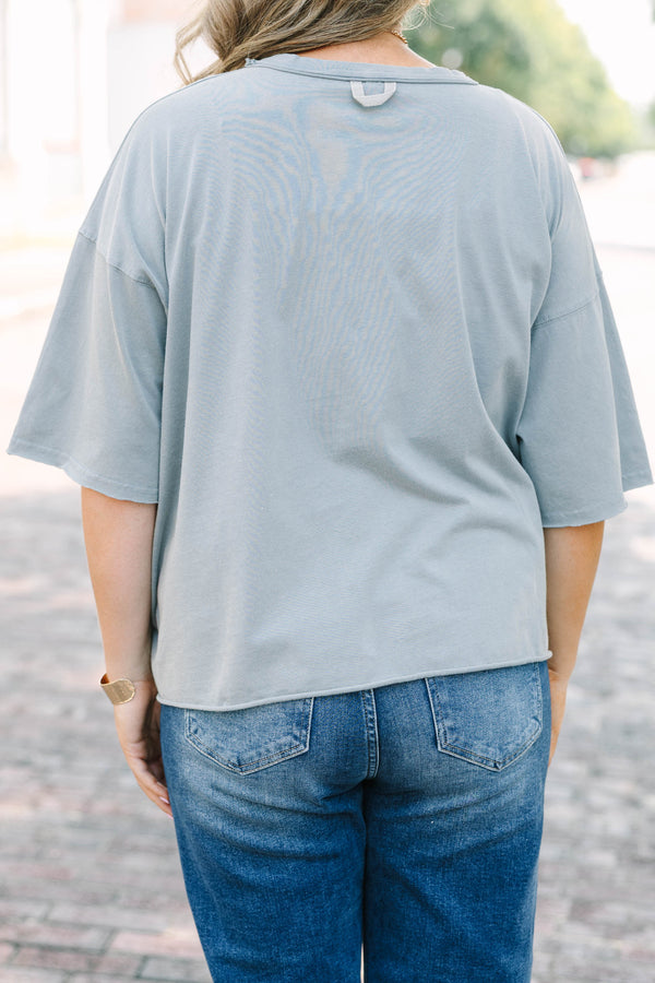 Plus Size steel blue vintage wash tee with Football Social Club graphic and unfinished hems.