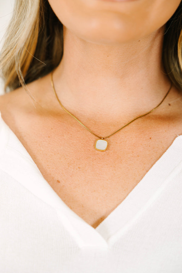 Gold box chain necklace featuring a square white mother of pearl pendant.