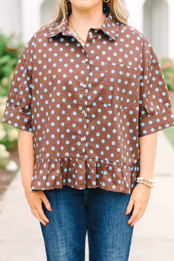 Plus Size brown button-down top with blue polka dots, short sleeves, and a ruffled hem.