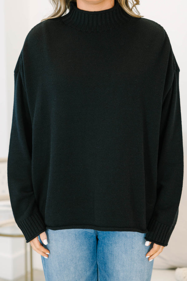 Plus Size black rollneck sweater with a relaxed fit, long sleeves, and ribbed knit details.