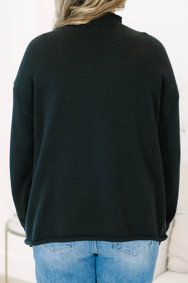 Plus Size black rollneck sweater with a relaxed fit, long sleeves, and ribbed knit details.