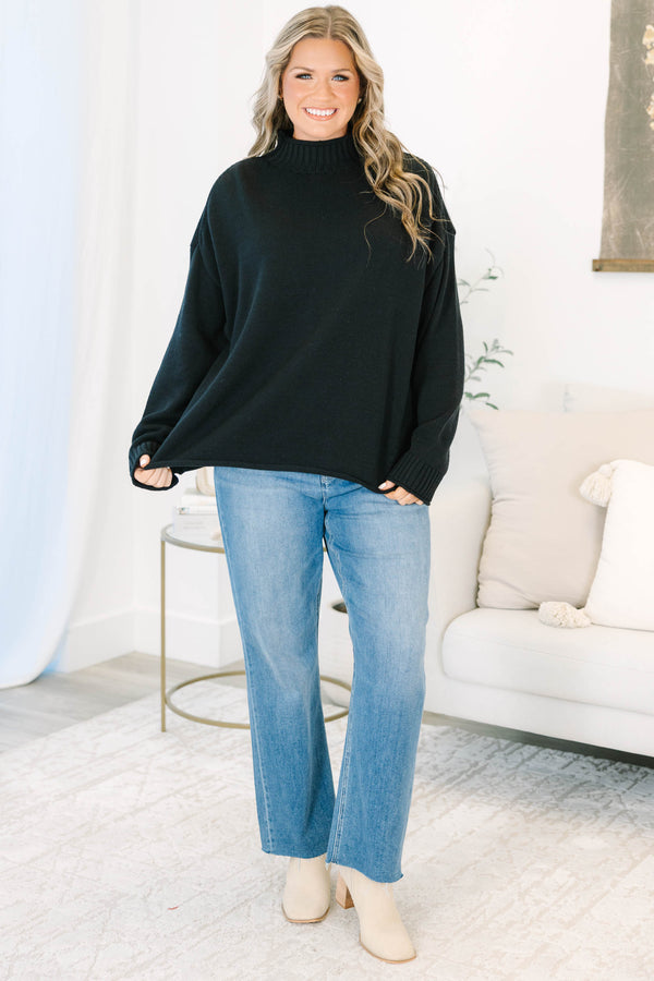 Plus Size black rollneck sweater with a relaxed fit, long sleeves, and ribbed knit details.