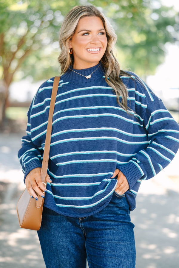 Plus Size navy rollneck sweater with horizontal teal and white stripes, long sleeves, and relaxed fit.