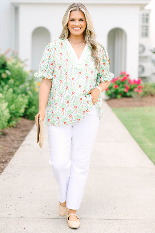 Plus size top in green with a fan print, V-neck, and ruffle puff sleeves.