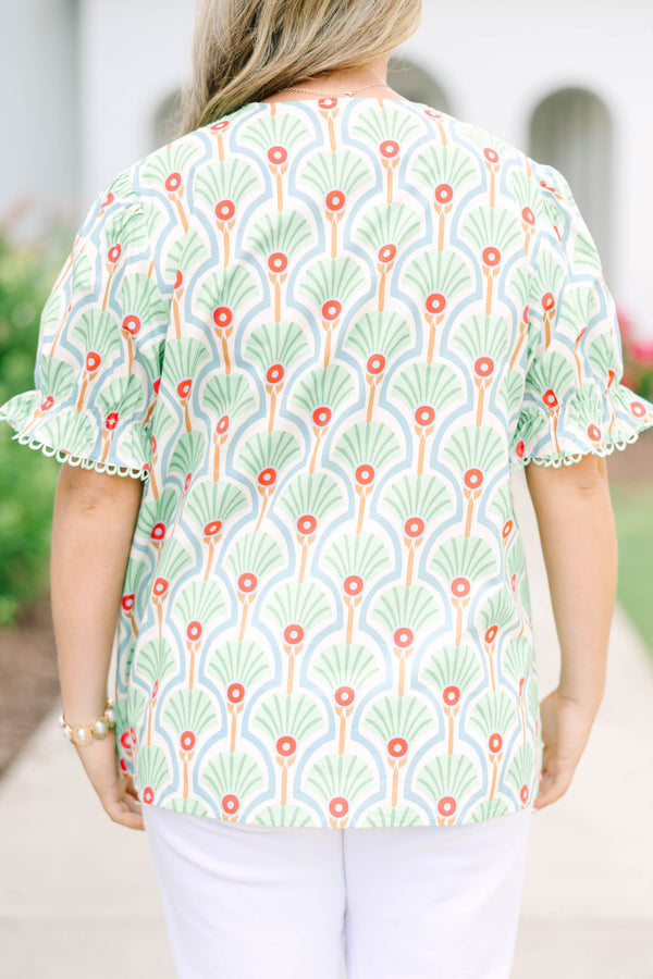 Plus size top in green with a fan print, V-neck, and ruffle puff sleeves.