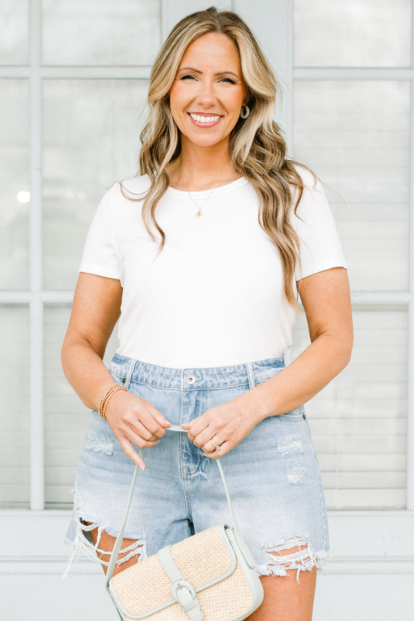 Chic Soul plus size clothing, medium light denim shorts with distressing along the bottom with raw hem
