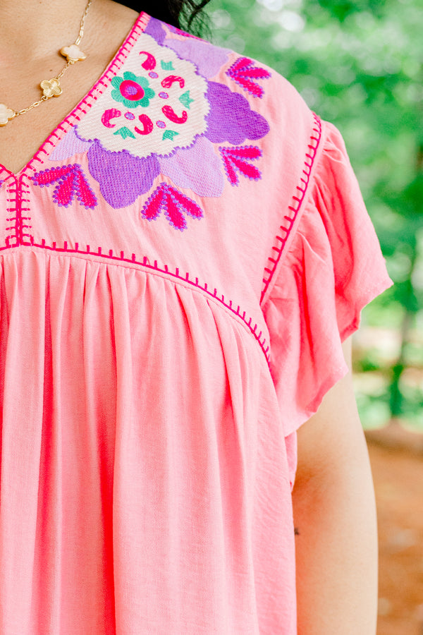 Chic Soul plus size clothing, light pink short-flutter sleeve shallow v-neck top with hot pink embroidered trim along neckline and shoulders plus purple and white embroidered pattern on shoulders
