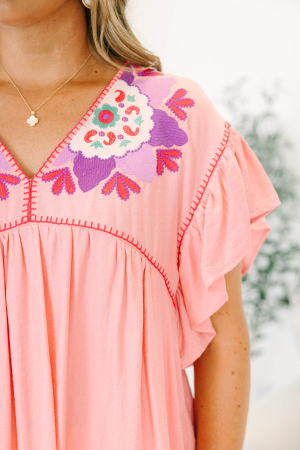 Chic Soul plus size clothing, light pink short-flutter sleeve shallow v-neck top with hot pink embroidered trim along neckline and shoulders plus purple and white embroidered pattern on shoulders