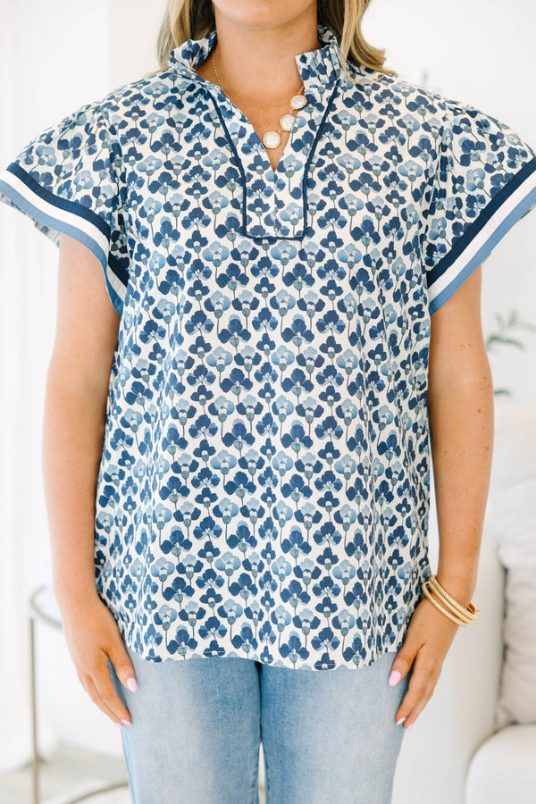 Plus Size navy and white floral print cotton top with a split neckline and short flutter sleeves.