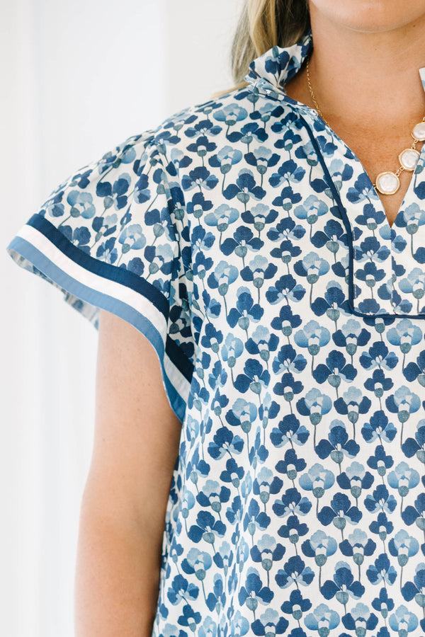 Plus Size navy and white floral print cotton top with a split neckline and short flutter sleeves.