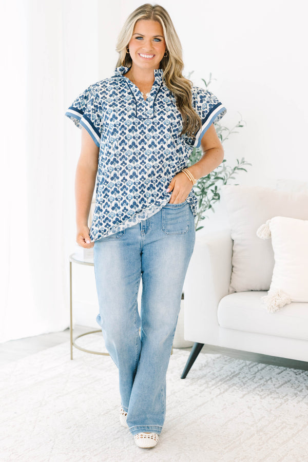 Plus Size navy and white floral print cotton top with a split neckline and short flutter sleeves.