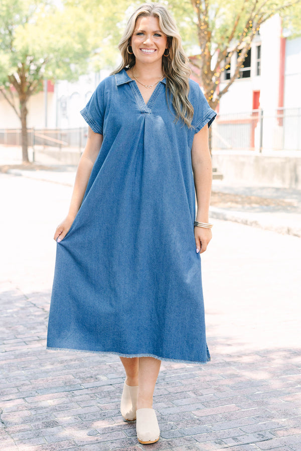 Plus Size blue denim midi dress with a collared V-neckline, short sleeves, and a frayed hem.