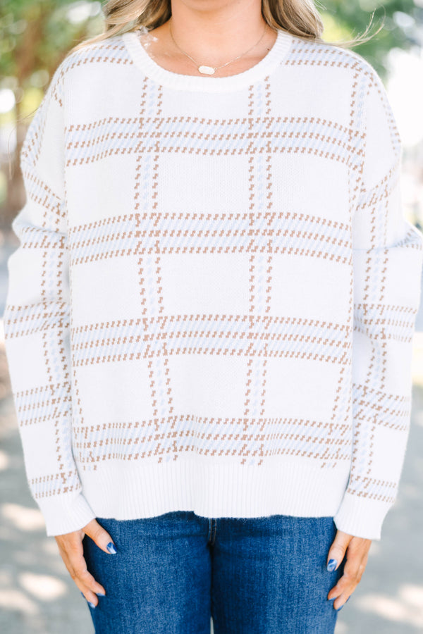 Plus Size ivory crewneck sweater with a tan and blue plaid pattern and long sleeves.