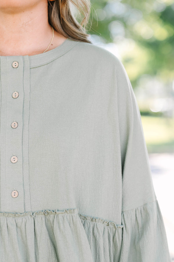 Chic Soul plus size clothing, olive green long sleeve baby doll top with buttons half way down 