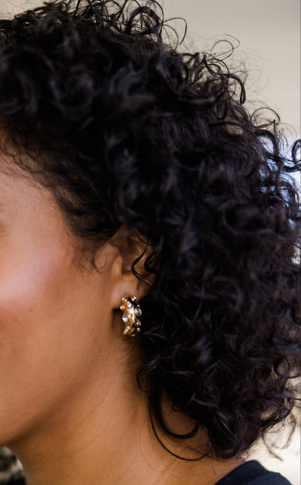 Plus Size gold hoop earrings with a textured finish and embedded sparkling silver gemstones.