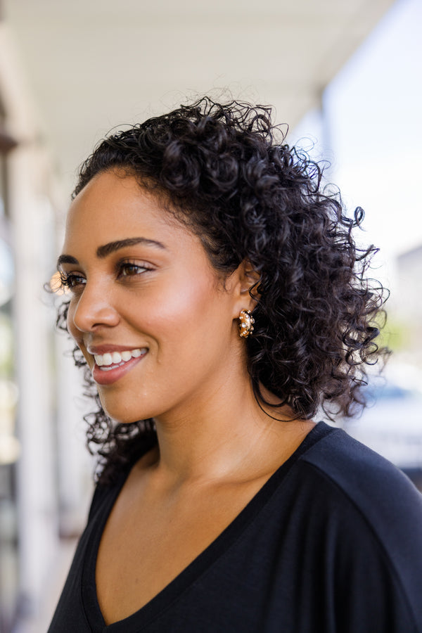 Plus Size gold hoop earrings with a textured finish and embedded sparkling silver gemstones.