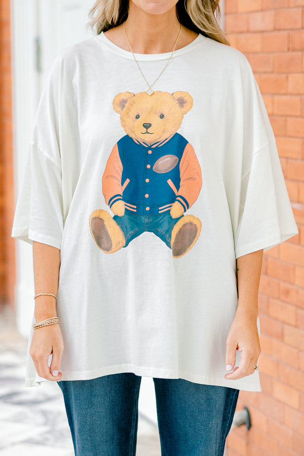 Chic Soul plus size clothing, white short sleeve boyfriend tee with a teddy bear on the center of the shirt that has on a football letterman jacket 