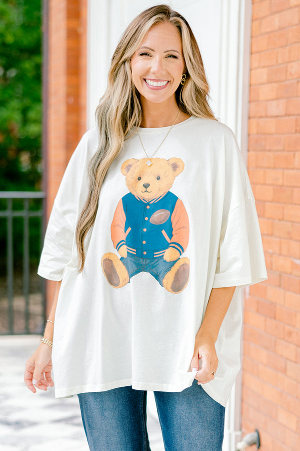 Chic Soul plus size clothing, white short sleeve boyfriend tee with a teddy bear on the center of the shirt that has on a football letterman jacket 