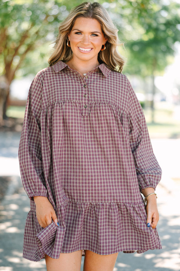 Plus Size burgundy plaid mini dress with a collared neckline, button-up bodice, and tiered skirt.