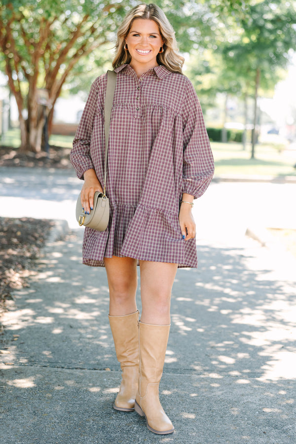 Plus Size burgundy plaid mini dress with a collared neckline, button-up bodice, and tiered skirt.