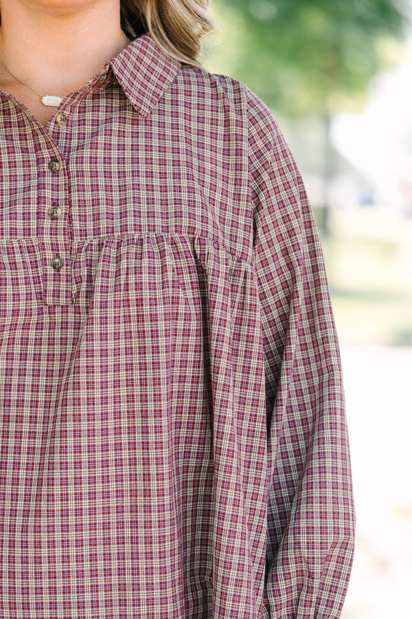 Plus Size burgundy plaid mini dress with a collared neckline, button-up bodice, and tiered skirt.