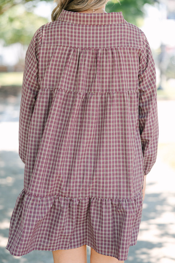 Plus Size burgundy plaid mini dress with a collared neckline, button-up bodice, and tiered skirt.