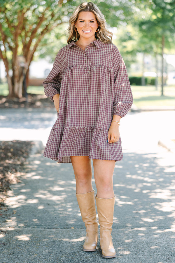 Plus Size burgundy plaid mini dress with a collared neckline, button-up bodice, and tiered skirt.