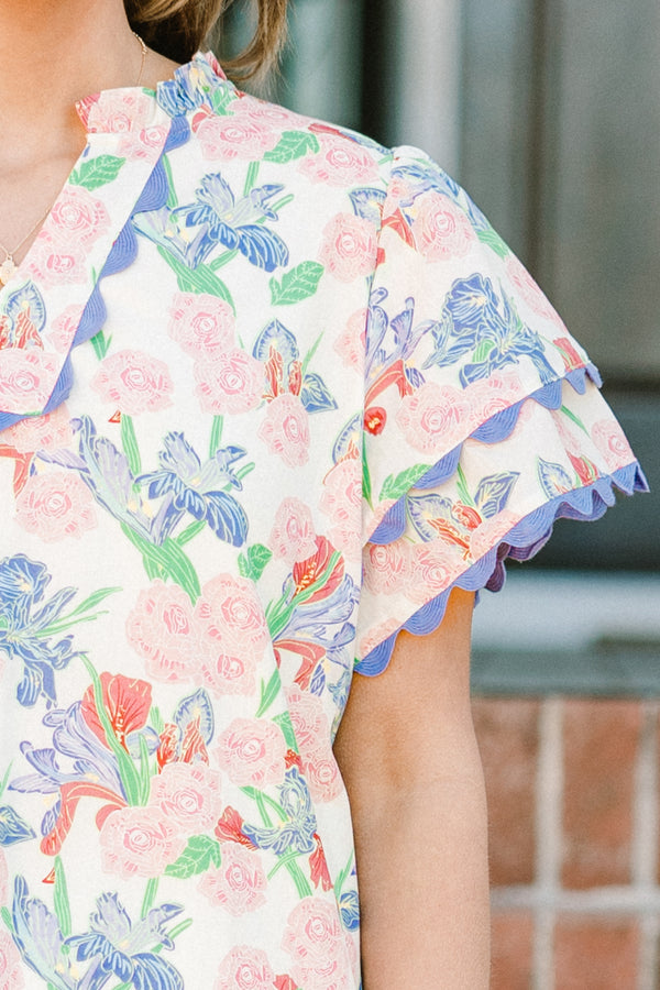 Chic Soul plus size clothing, blue floral multi print short sleeve top with v neckline and tiered ruffle sleeves with scalloped purple edges along sleeves and neckline