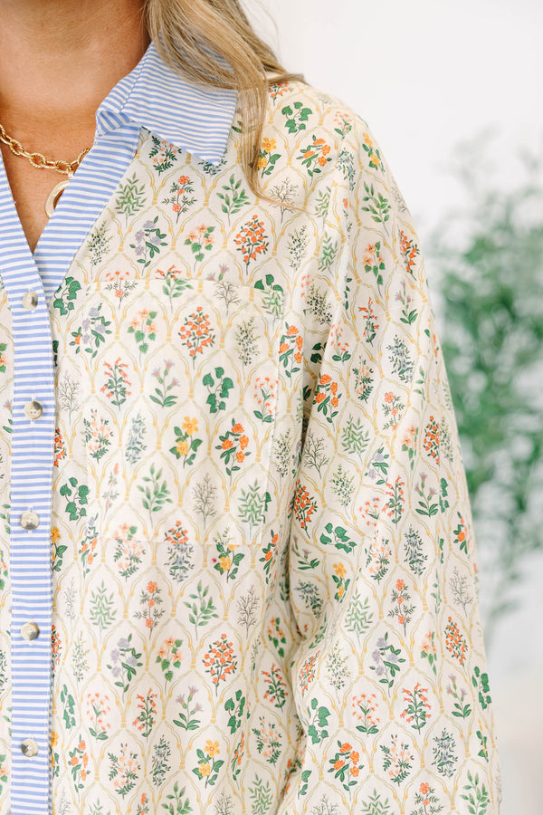 Chic Soul plus size clothing, cream colored long-puff sleeve collared button-up pocket top with leafy floral pattern and blue and white striped blocking around collar and buttons