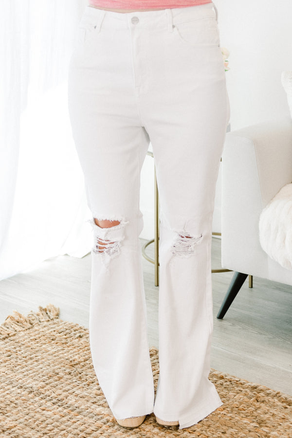 Chic Soul plus size clothing, white denim flare jeans with raw hem at the bottom with distressing along the knees