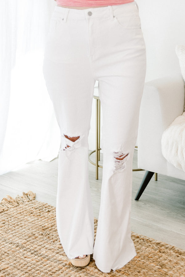 Chic Soul plus size clothing, white denim flare jeans with raw hem at the bottom with distressing along the knees